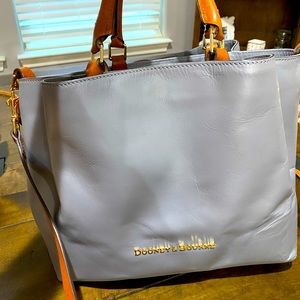 Dooney and Bourke bag. Dove gray/brown handles.